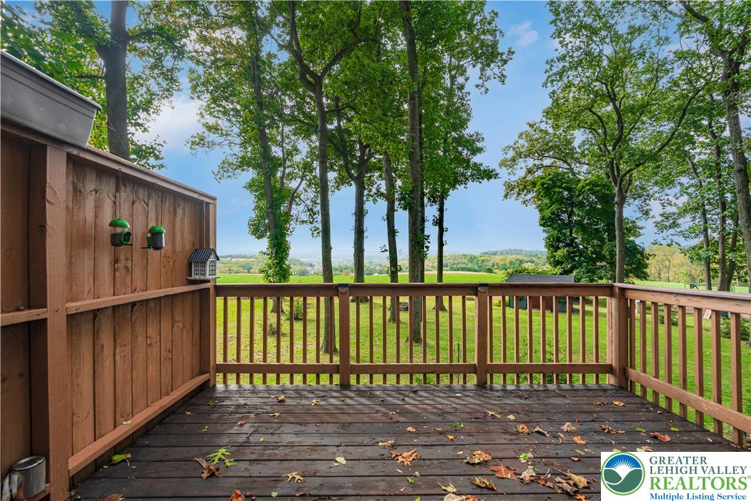 2569 Woods Edge Road Bath, PA 18014 - Photo 27 of 40 Mature trees frame a peaceful landscape beyond the wooden deck.