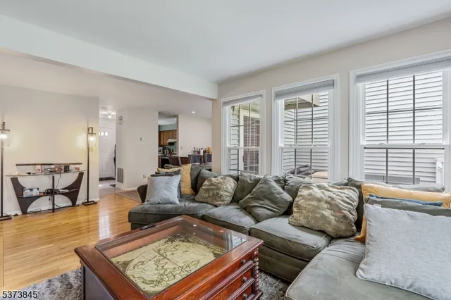 a living room with furniture and a table