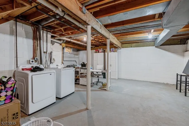 a view of storage and utility room with stairs