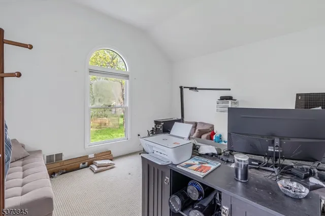 a room with furniture and a window