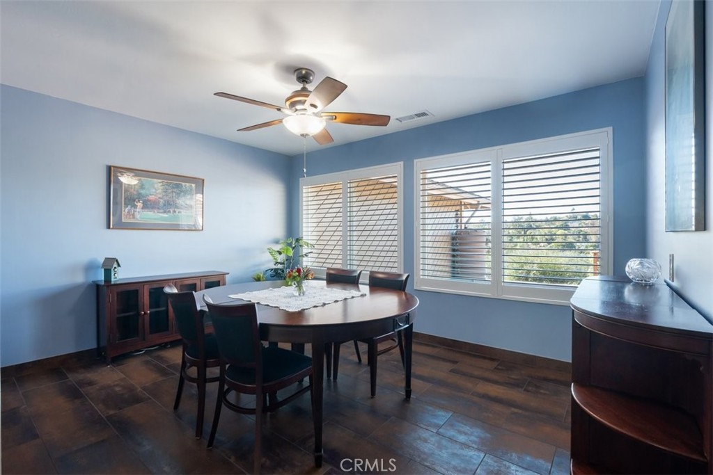 1106 Big Oak Ranch Road Fallbrook, CA 92028 - Photo 12 of 33 a view of a dining room with furniture window and wooden floor