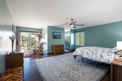 a spacious bedroom with a bed and a couch