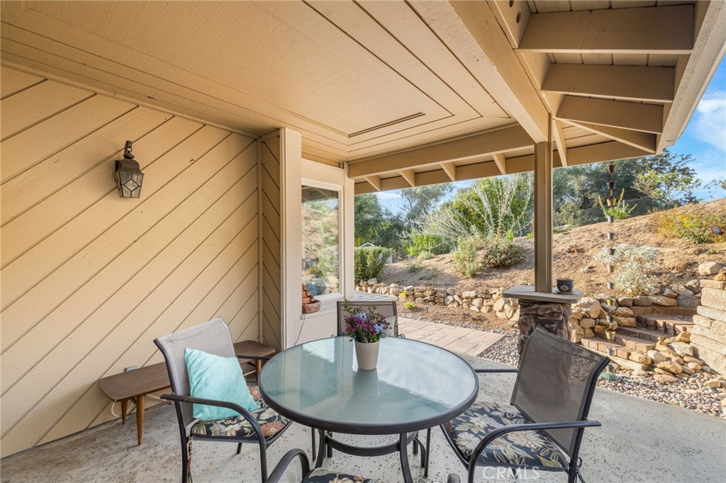 1106 Big Oak Ranch Road Fallbrook, CA 92028 - Photo 27 of 33 a outdoor dining space with furniture and garden