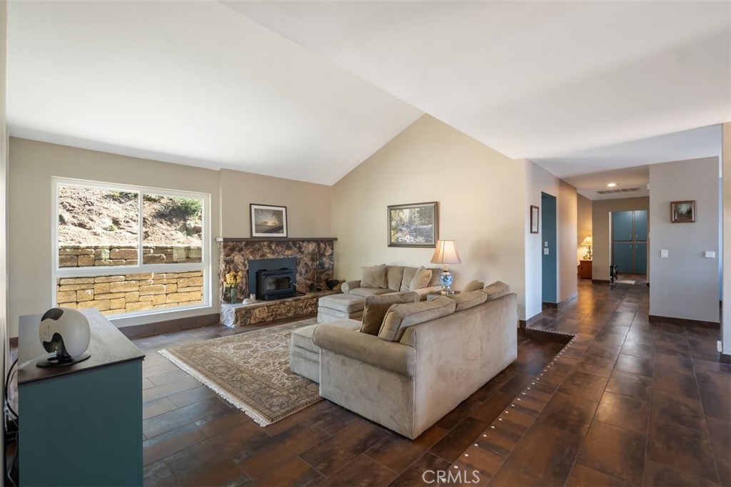 1106 Big Oak Ranch Road Fallbrook, CA 92028 - Photo 8 of 33 a living room with furniture large window and a fireplace
