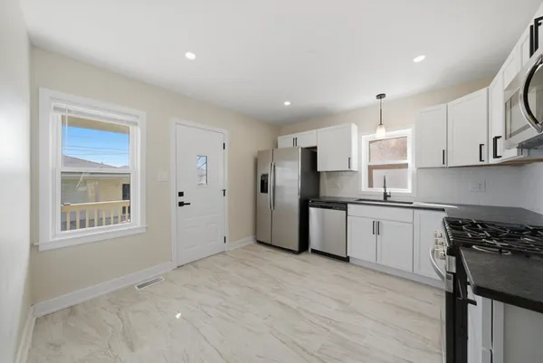 $415,000 | 6535 South Kolin Avenue, Chicago, IL 60629