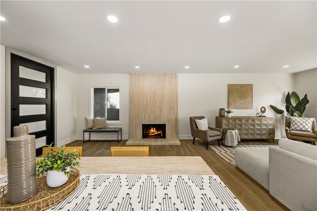 2440 Ostrom Avenue Long Beach, CA 90815 - Photo 15 of 50 a living room with furniture and a fireplace