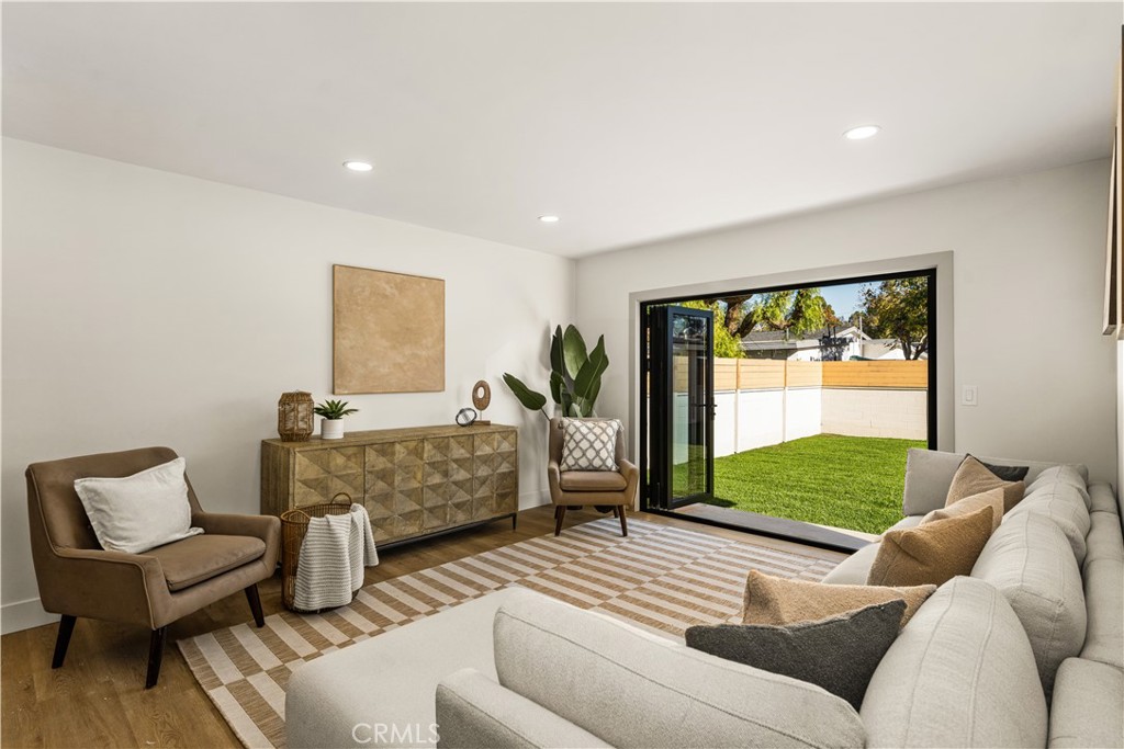 2440 Ostrom Avenue Long Beach, CA 90815 - Photo 16 of 50 a bedroom with a bed and a couch