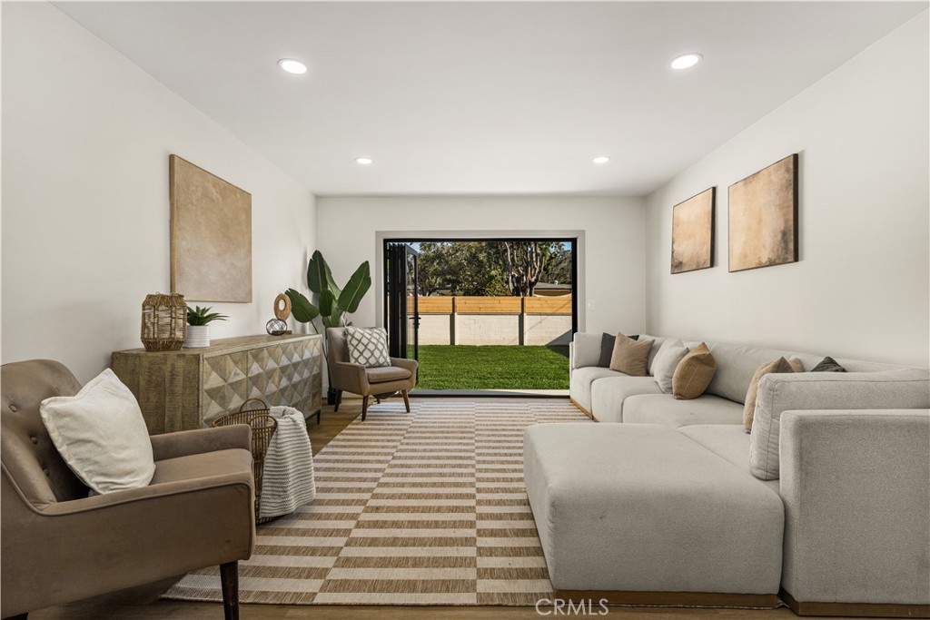 2440 Ostrom Avenue Long Beach, CA 90815 - Photo 17 of 50 a living room with furniture and a large window