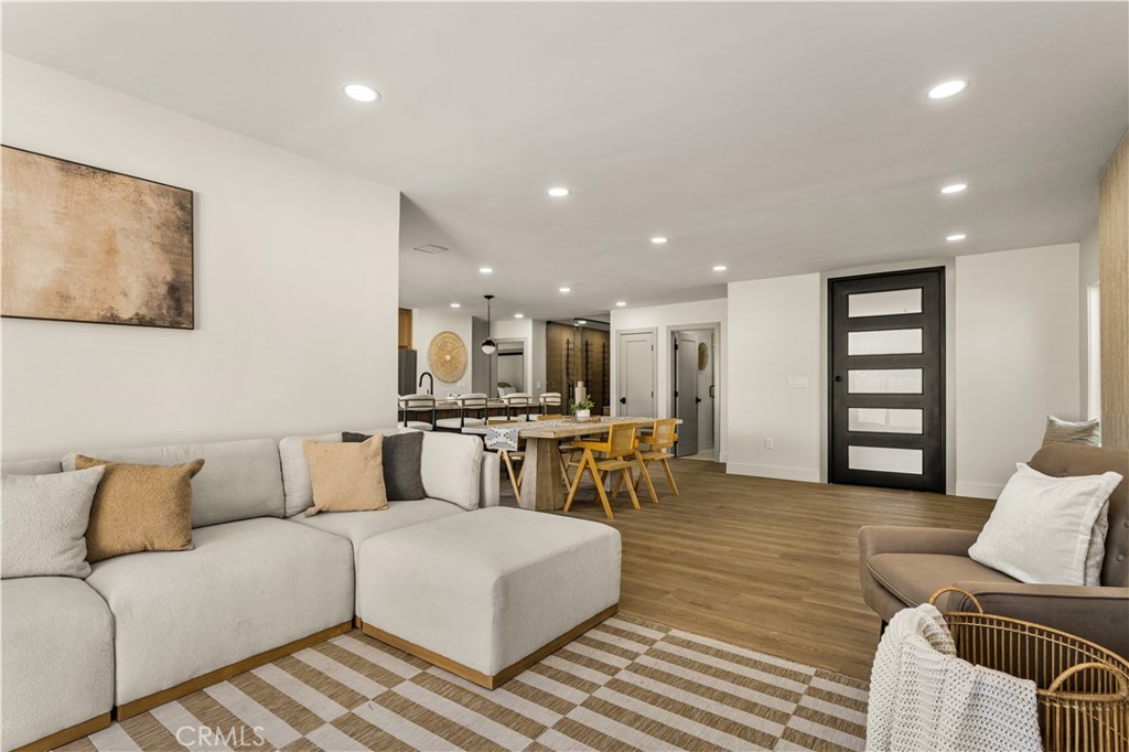 2440 Ostrom Avenue Long Beach, CA 90815 - Photo 19 of 50 a living room with furniture kitchen view and a couch