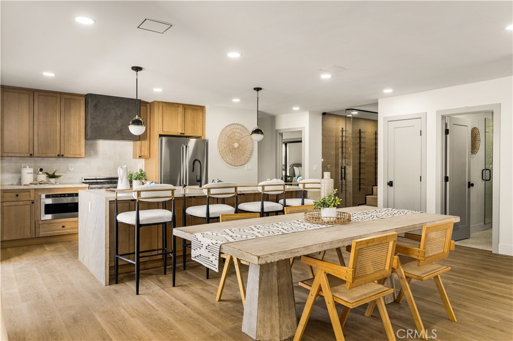 2440 Ostrom Avenue Long Beach, CA 90815 - Photo 20 of 50 a kitchen with a table and chairs in it