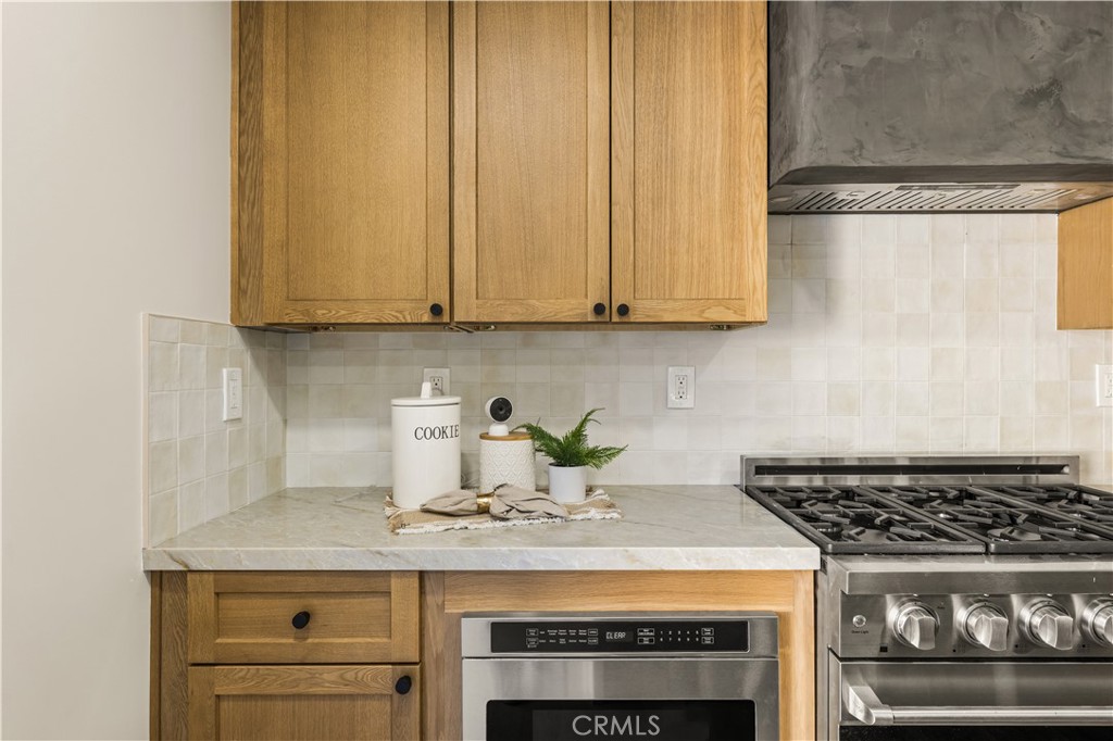 2440 Ostrom Avenue Long Beach, CA 90815 - Photo 27 of 50 a kitchen with a stove and a white cabinet