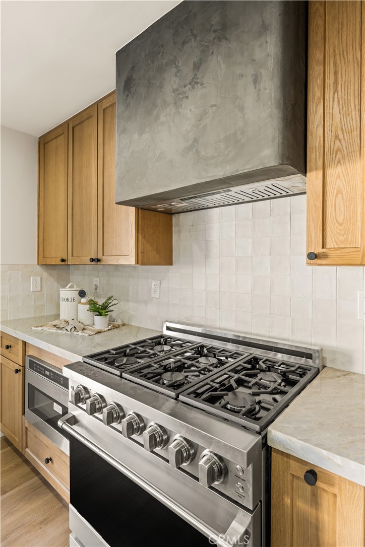 2440 Ostrom Avenue Long Beach, CA 90815 - Photo 28 of 50 a stove top oven sitting inside of a kitchen