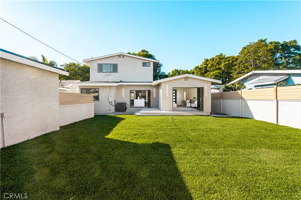 2440 Ostrom Avenue Long Beach, CA 90815 - Photo 32 of 50 a front view of house with yard and green space