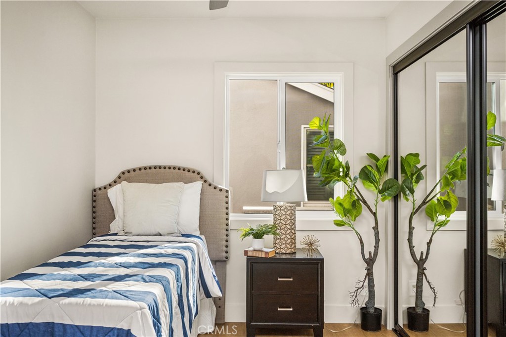 2440 Ostrom Avenue Long Beach, CA 90815 - Photo 35 of 50 a bedroom with a bed and a potted plant