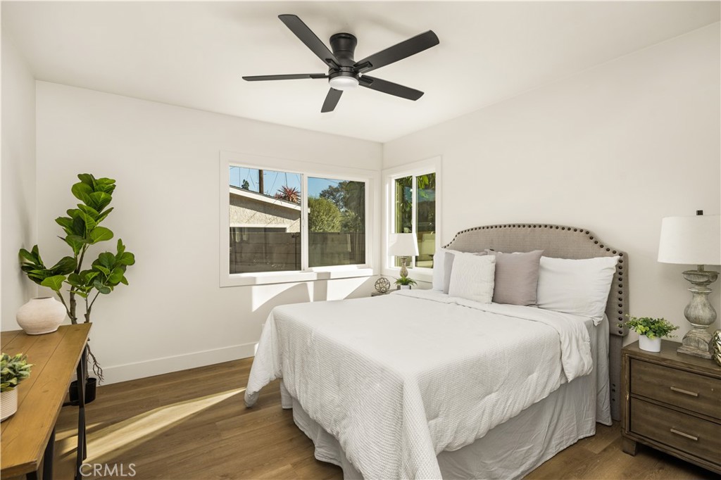 2440 Ostrom Avenue Long Beach, CA 90815 - Photo 37 of 50 a bedroom with a bed potted plant and a window