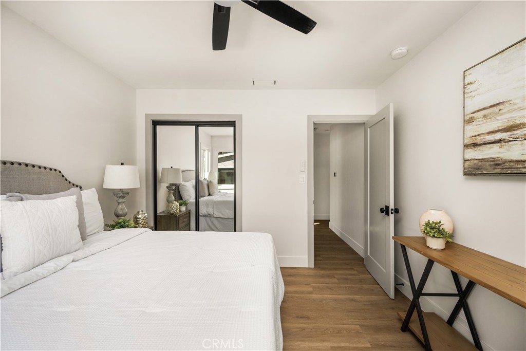 2440 Ostrom Avenue Long Beach, CA 90815 - Photo 38 of 50 a bedroom with a bed and a chandelier