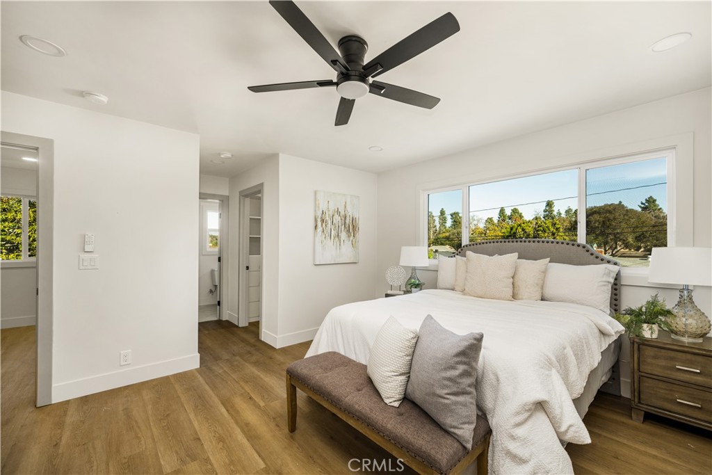 2440 Ostrom Avenue Long Beach, CA 90815 - Photo 45 of 50 a bedroom with a bed and wooden floor