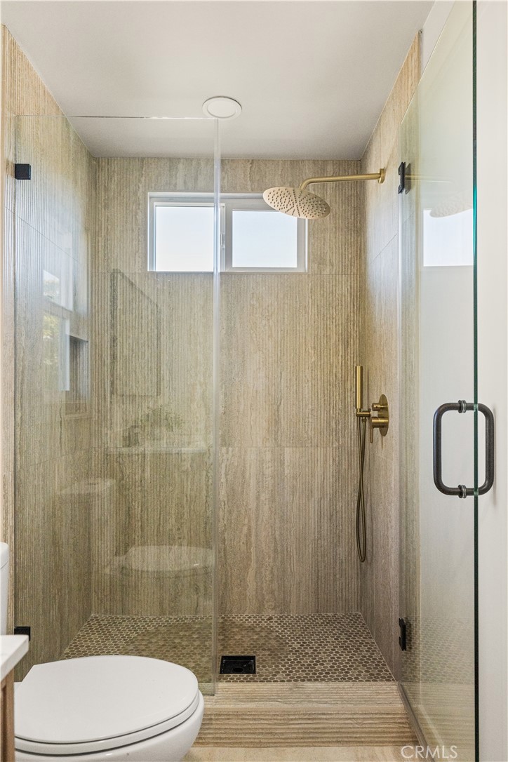 2440 Ostrom Avenue Long Beach, CA 90815 - Photo 48 of 50 a bathroom with a shower and a toilet