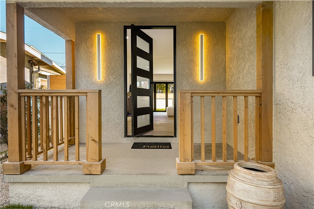 2440 Ostrom Avenue Long Beach, CA 90815 - Photo 6 of 50 a bathroom with a granite countertop sink and a toilet