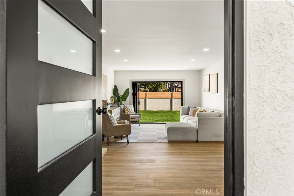 2440 Ostrom Avenue Long Beach, CA 90815 - Photo 7 of 50 a living room with furniture and a flat screen tv