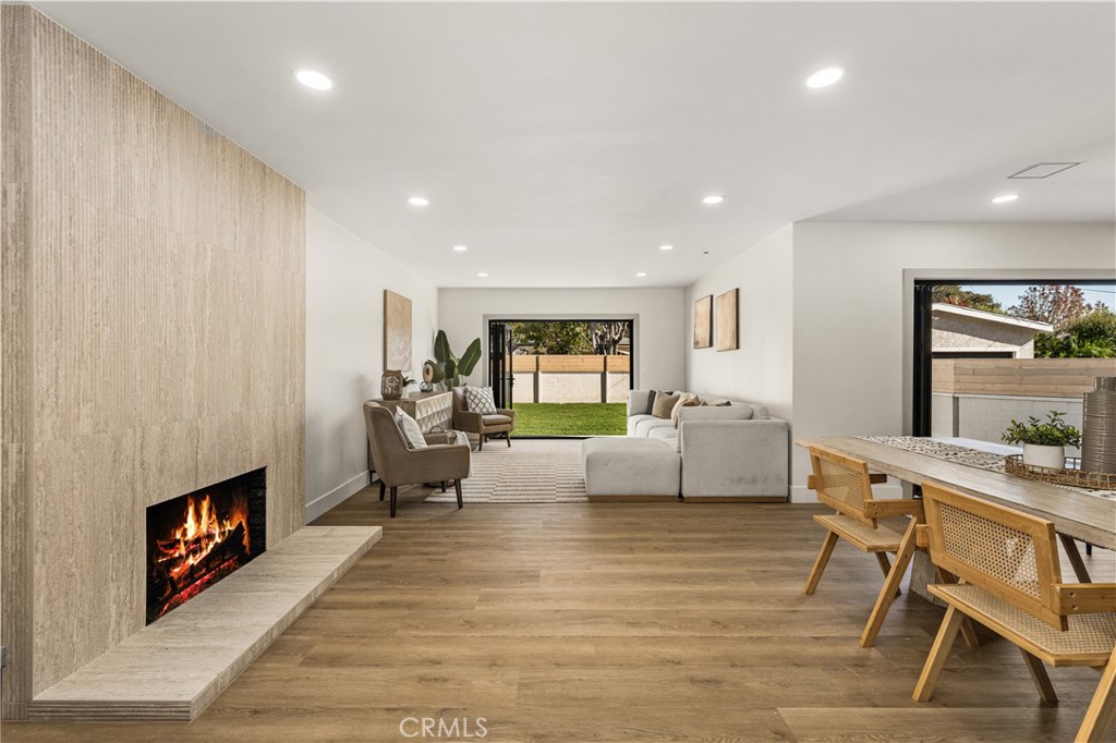 2440 Ostrom Avenue Long Beach, CA 90815 - Photo 8 of 50 a living room with furniture and a fireplace