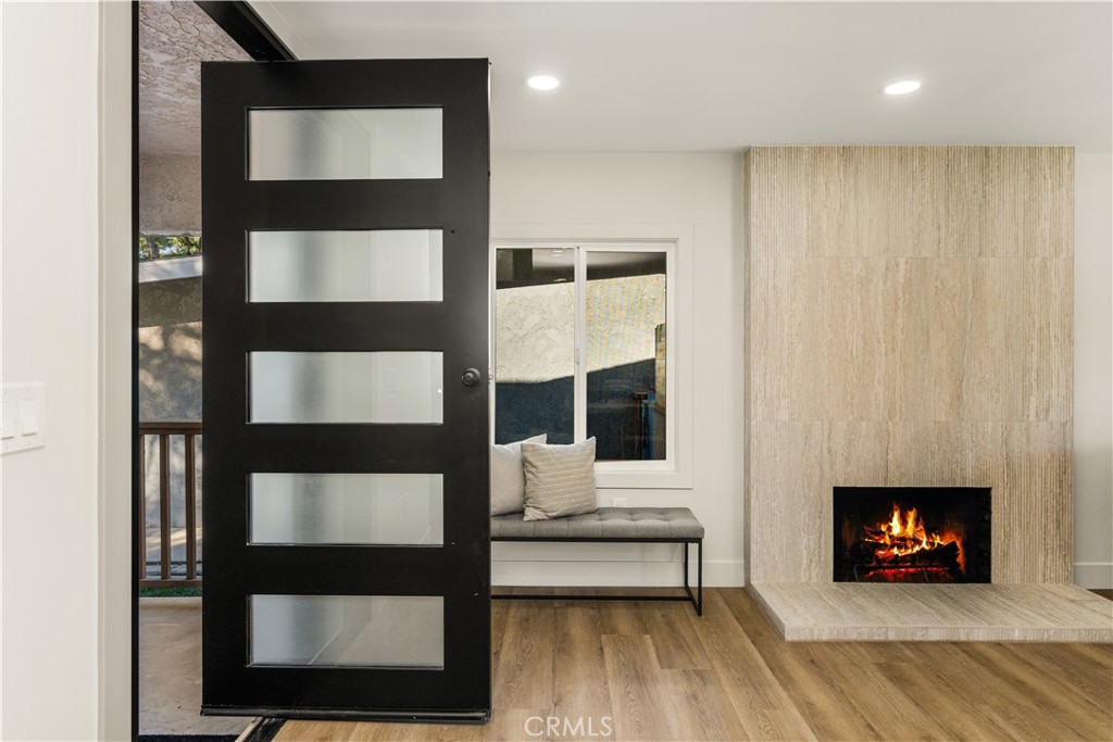 2440 Ostrom Avenue Long Beach, CA 90815 - Photo 9 of 50 a living room with furniture and a fireplace