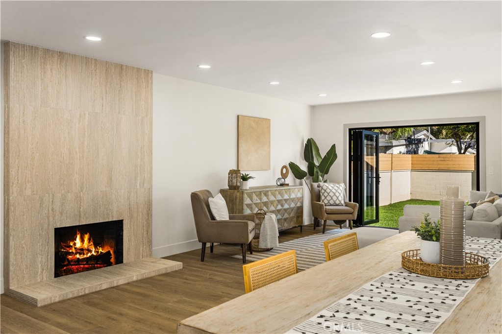 2440 Ostrom Avenue Long Beach, CA 90815 - Photo 10 of 50 a living room with furniture and a fireplace