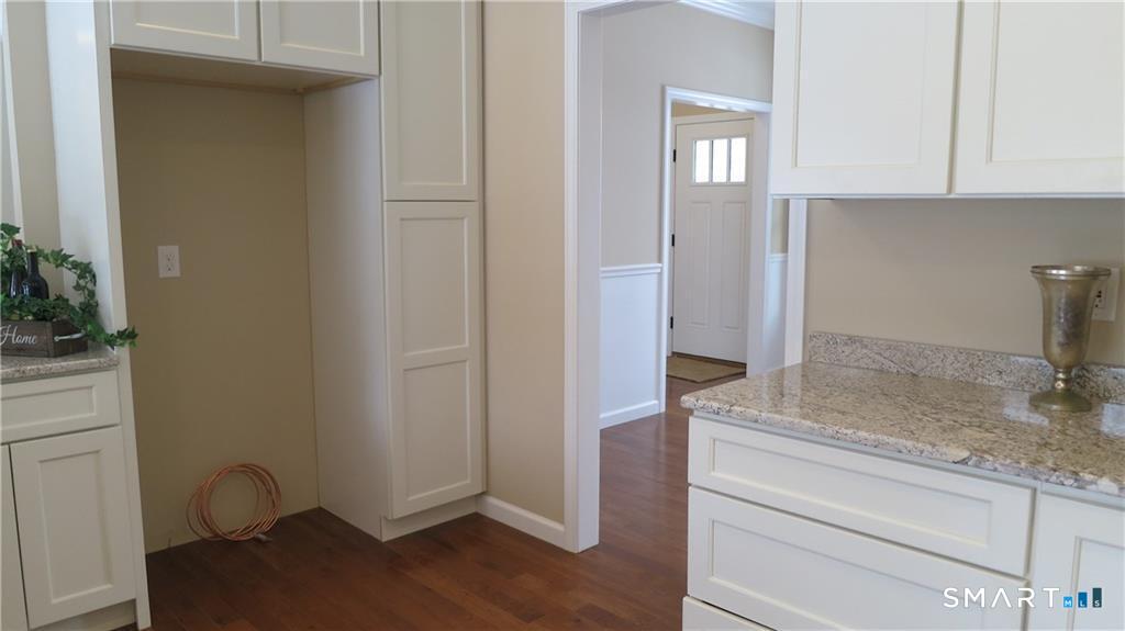 823 Stone Road Windsor, CT 06095 - Photo 21 of 38 a room with a sink and a mirror