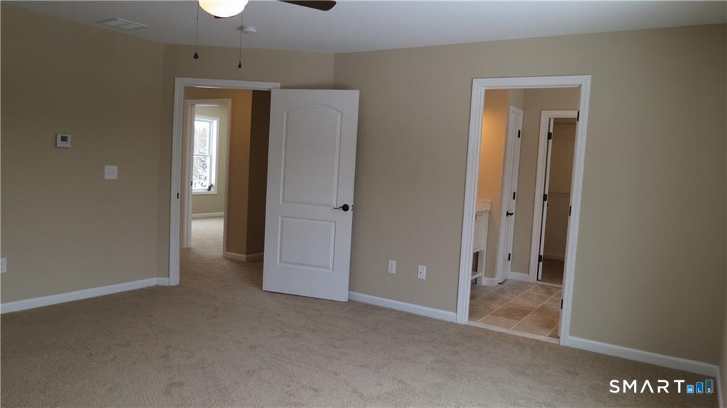 823 Stone Road Windsor, CT 06095 - Photo 30 of 38 an empty room with closet and a bathroom