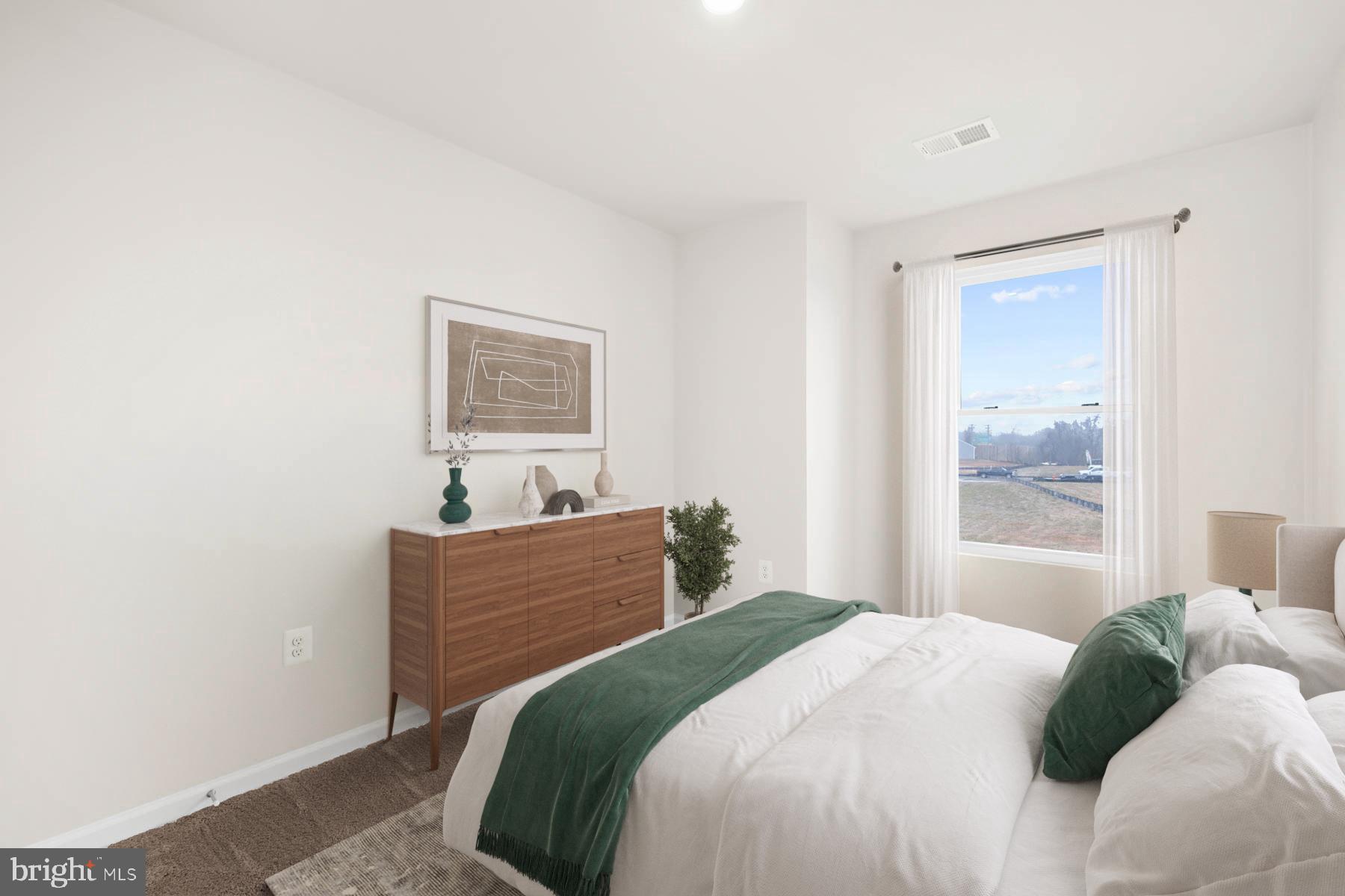 8128 Bartholomew Court Baltimore, MD 21206 - Photo 13 of 14 a bedroom with a bed and a window