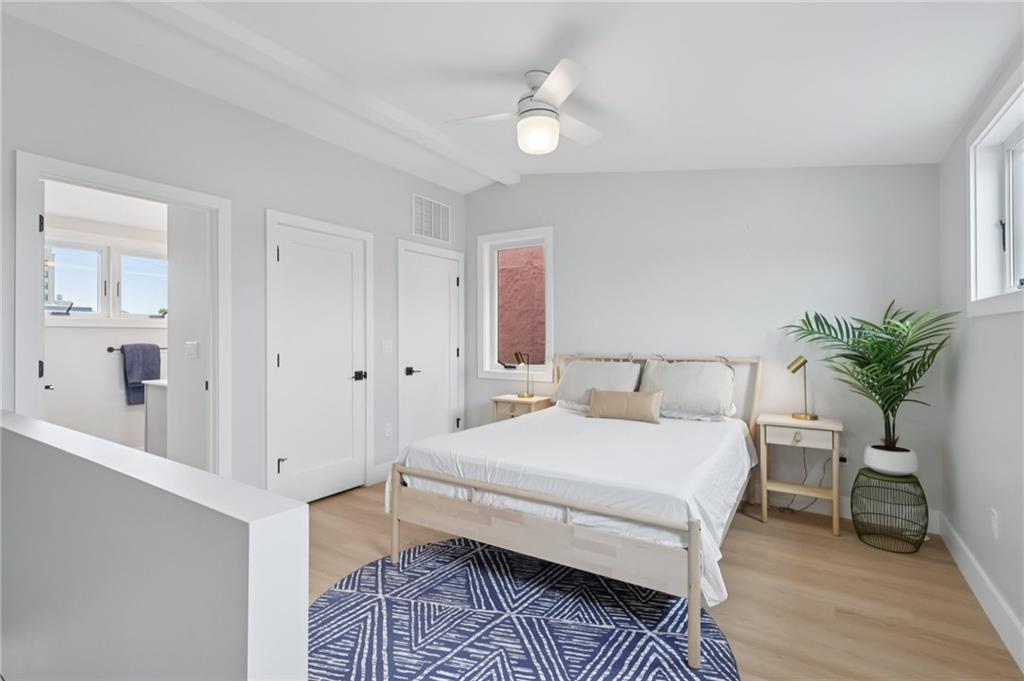1211 Boyle Street Pittsburgh, PA 15212 - Photo 28 of 38 a bedroom with a bed and a chair