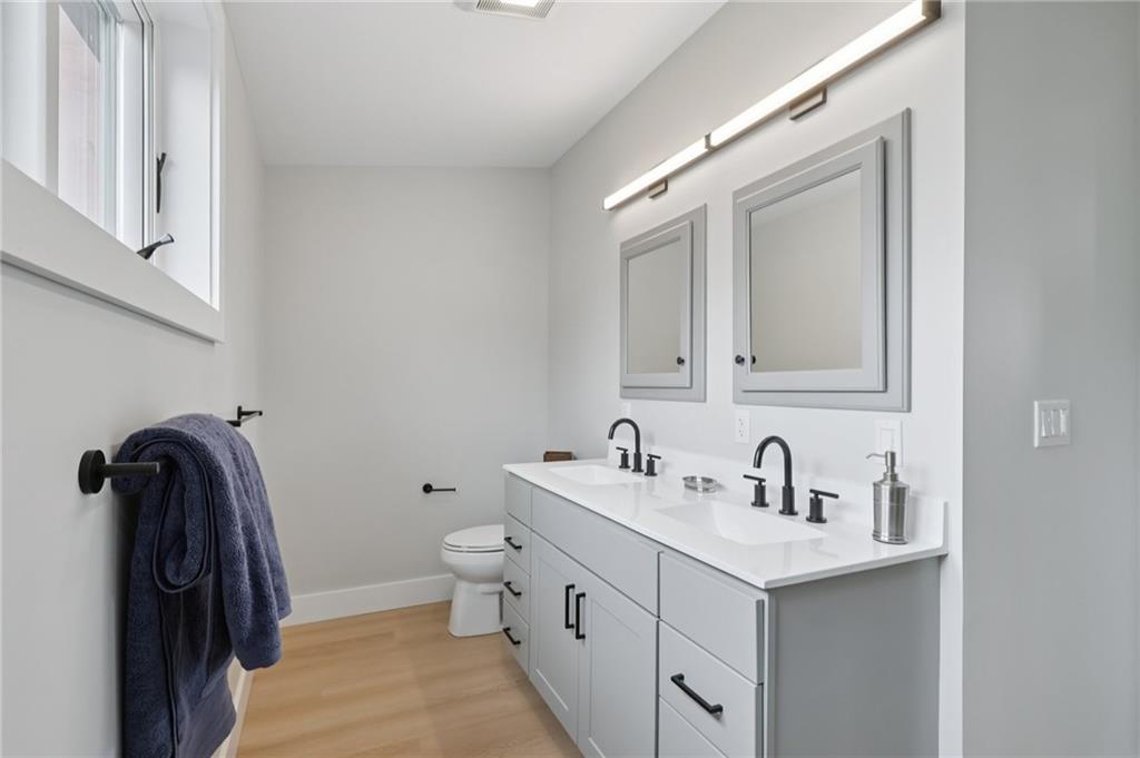 1211 Boyle Street Pittsburgh, PA 15212 - Photo 29 of 38 a bathroom with a sink and a mirror