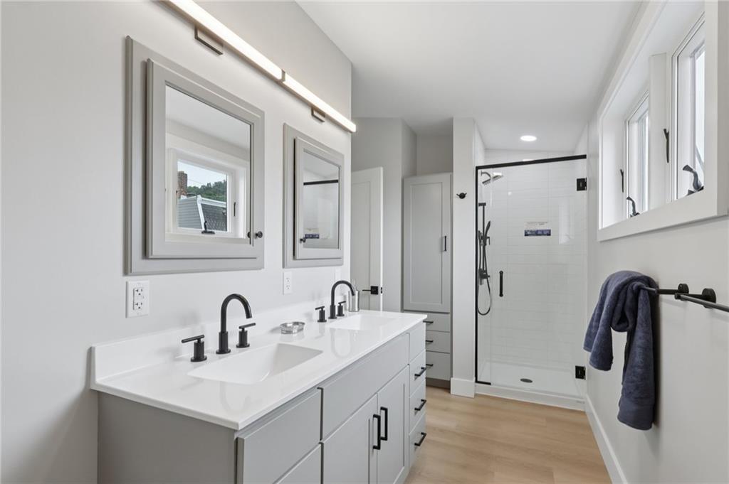 1211 Boyle Street Pittsburgh, PA 15212 - Photo 30 of 38 a bathroom with a sink and mirror