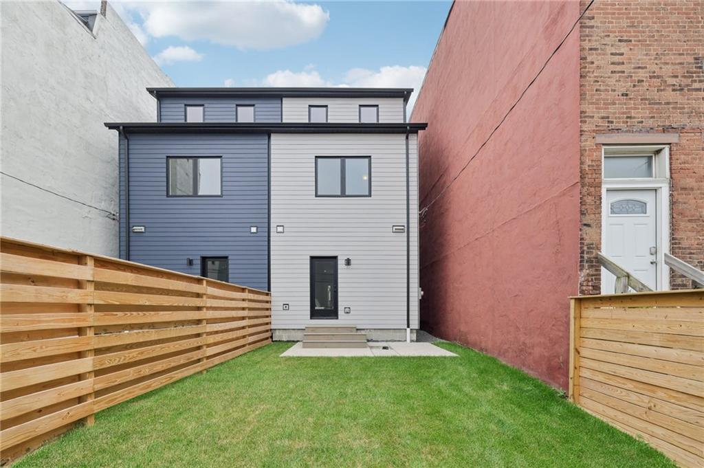 1211 Boyle Street Pittsburgh, PA 15212 - Photo 31 of 38 a view of a house with a backyard