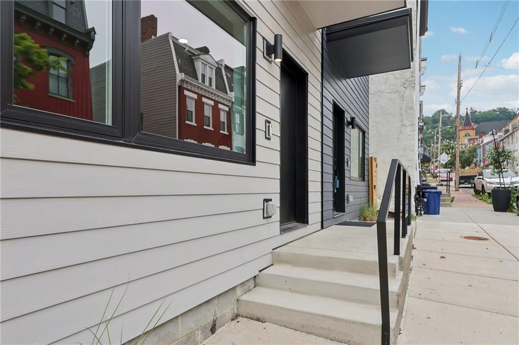 1211 Boyle Street Pittsburgh, PA 15212 - Photo 37 of 38 a front view of a building with parking space