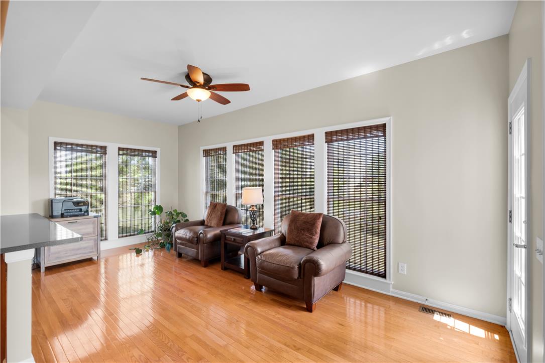 1709 Travers Road Breinigsville, PA 18031 - Photo 17 of 55 Hardwood floors and generous windows illuminate this inviting living area.