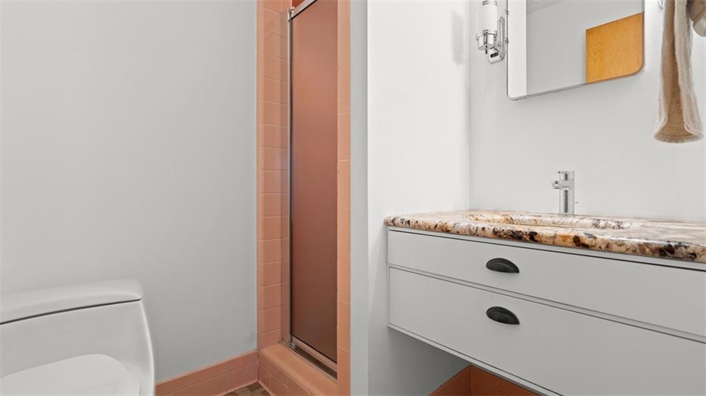 507 Rochester Road Rochester, PA 15074 - Photo 24 of 35 a bathroom with a sink and a mirror