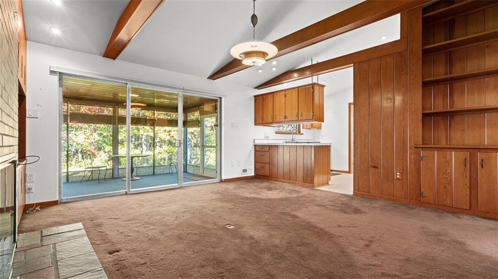 507 Rochester Road Rochester, PA 15074 - Photo 4 of 35 a view of empty room with wooden floor and fan