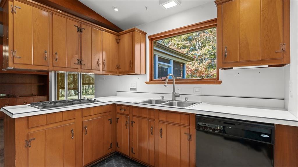 507 Rochester Road Rochester, PA 15074 - Photo 7 of 35 a kitchen with stainless steel appliances granite countertop a sink and cabinets