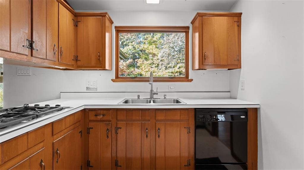 507 Rochester Road Rochester, PA 15074 - Photo 8 of 35 a kitchen with stainless steel appliances a sink stove and cabinets