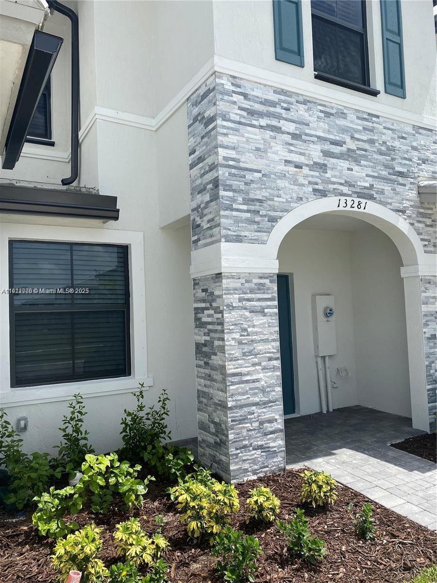 13281 Southwest 285th Street Homestead, FL 33033 - Photo 13 of 27 a front view of a house with plants