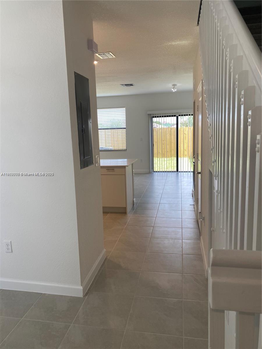 13281 Southwest 285th Street Homestead, FL 33033 - Photo 17 of 27 an empty room with windows