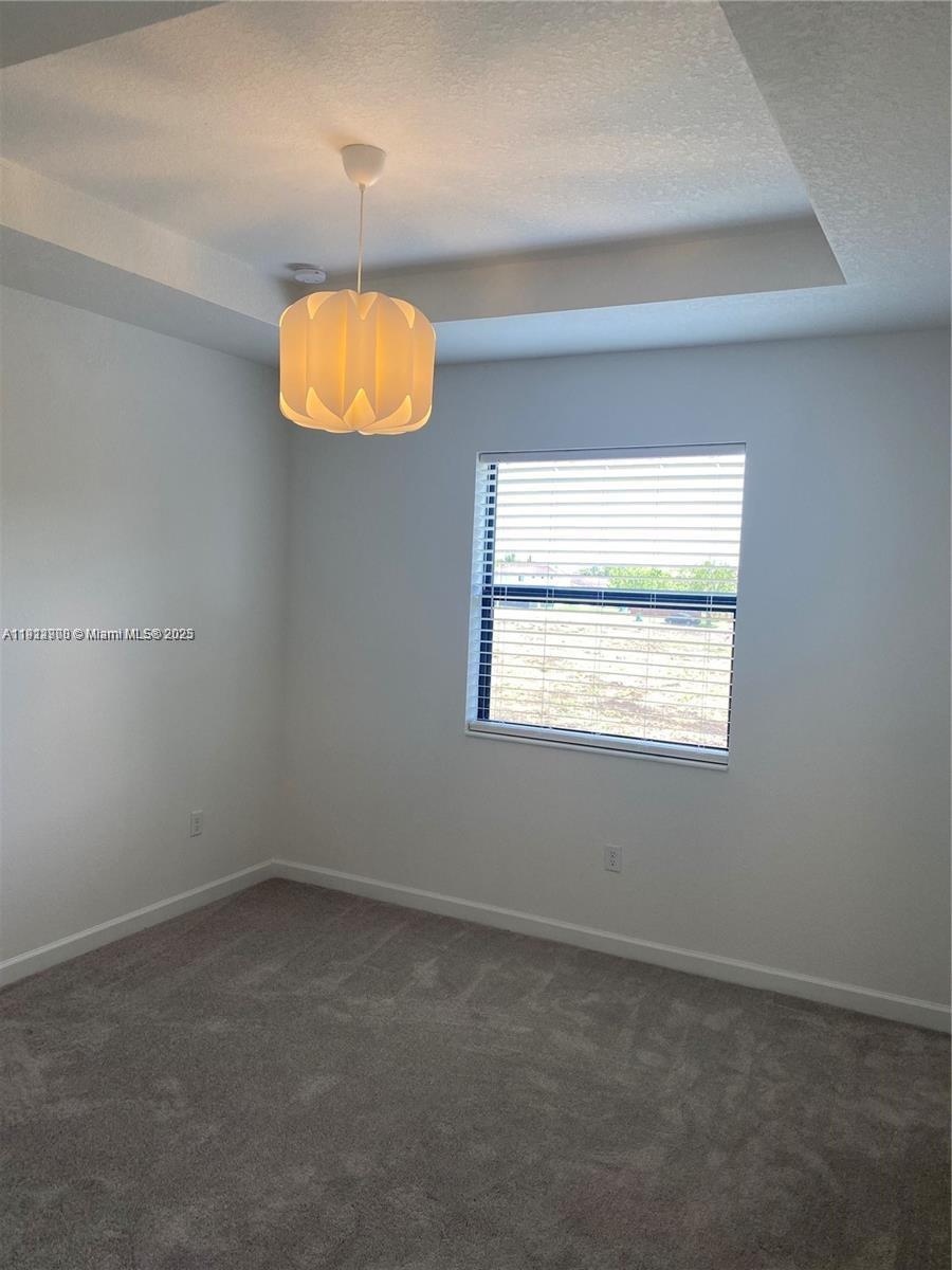 13281 Southwest 285th Street Homestead, FL 33033 - Photo 23 of 27 an empty room with a window