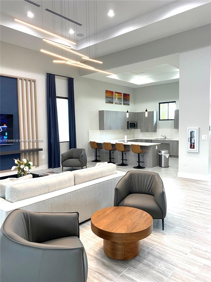 13281 Southwest 285th Street Homestead, FL 33033 - Photo 9 of 27 a living room with furniture and a large window