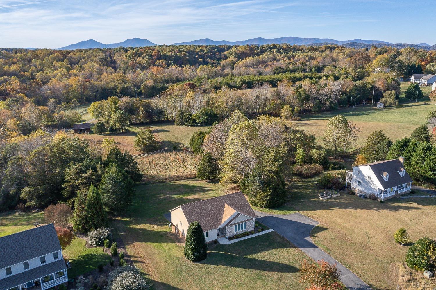 2629 Everett Road Forest, VA 24551 - Photo 1 of 47 an aerial view of a house with a lake view