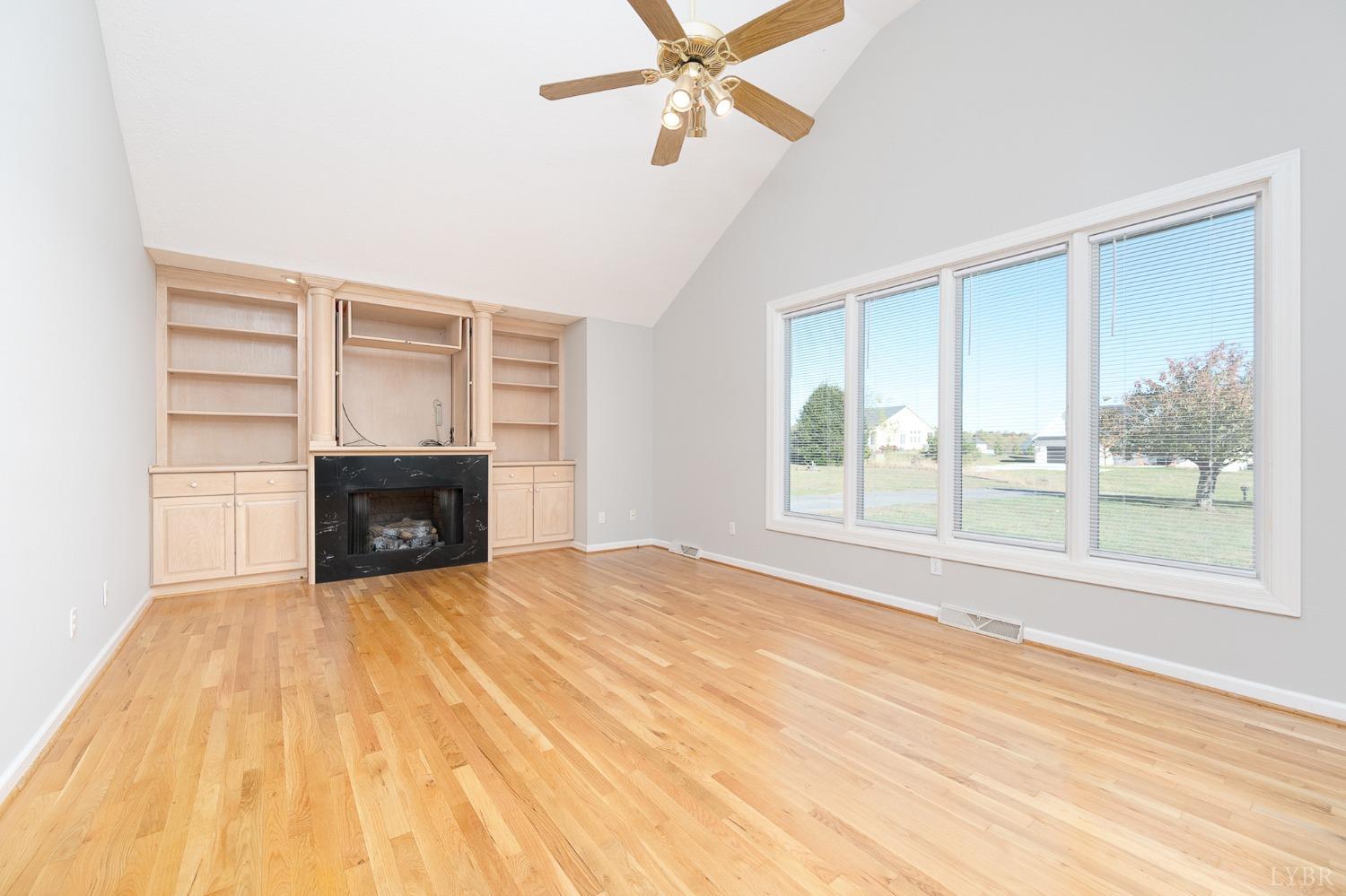 2629 Everett Road Forest, VA 24551 - Photo 11 of 47 a view of empty room with fireplace and fan