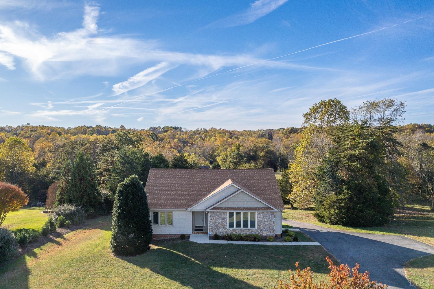 2629 Everett Road Forest, VA 24551 - Photo 2 of 47 a front view of a house with a garden