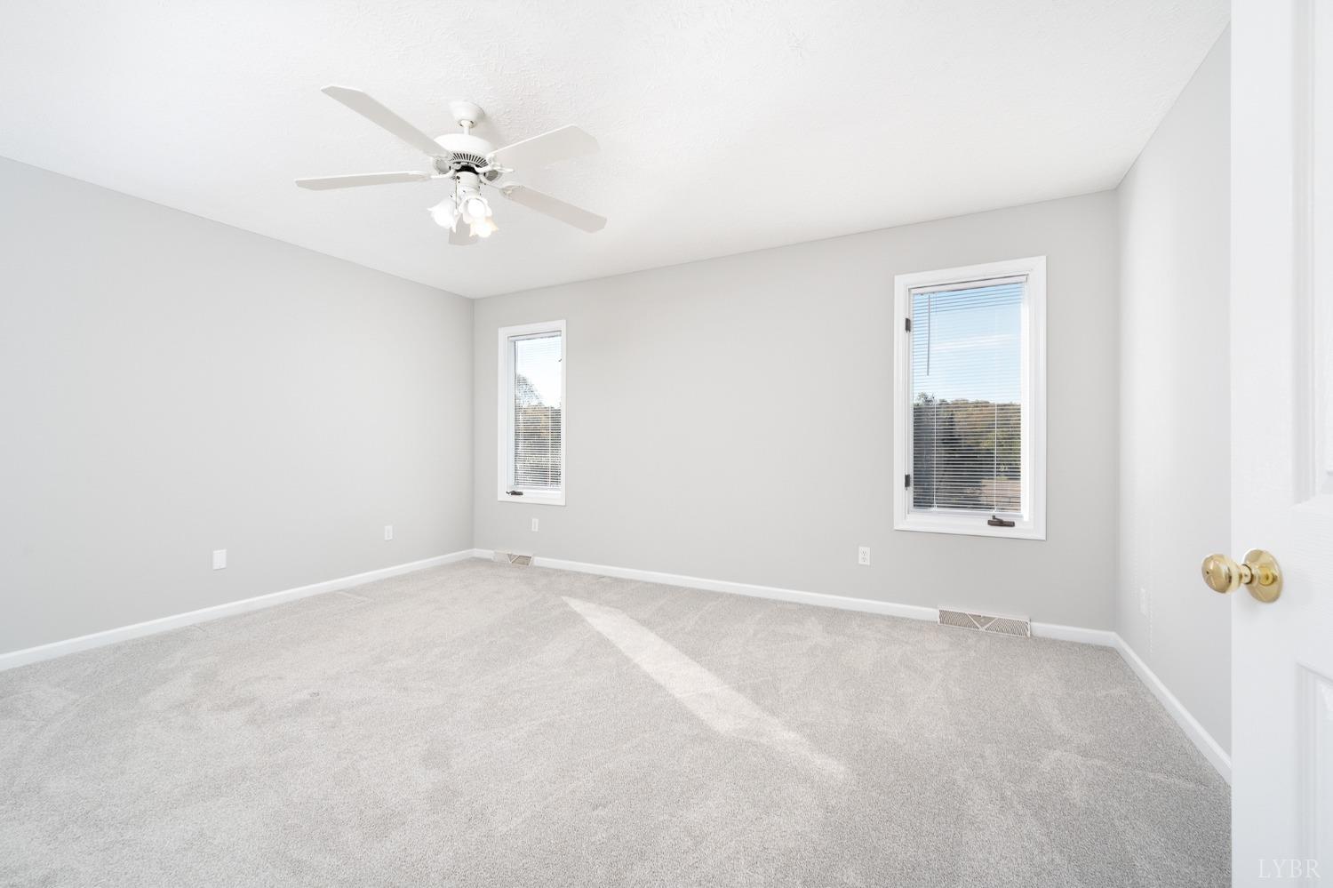 2629 Everett Road Forest, VA 24551 - Photo 26 of 47 an empty room with a window and a fan