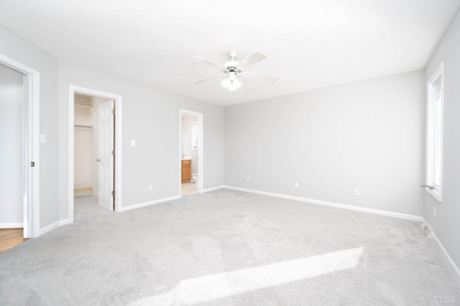 2629 Everett Road Forest, VA 24551 - Photo 27 of 47 an empty room with a ceiling fan and a window