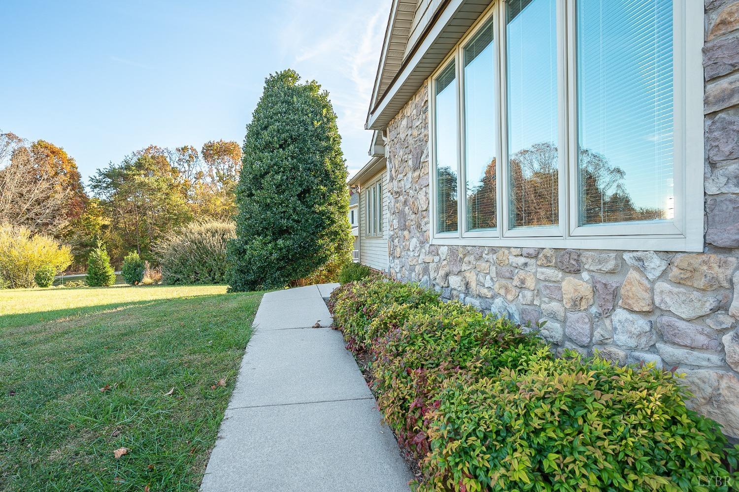 2629 Everett Road Forest, VA 24551 - Photo 6 of 47 a front view of a house with garden